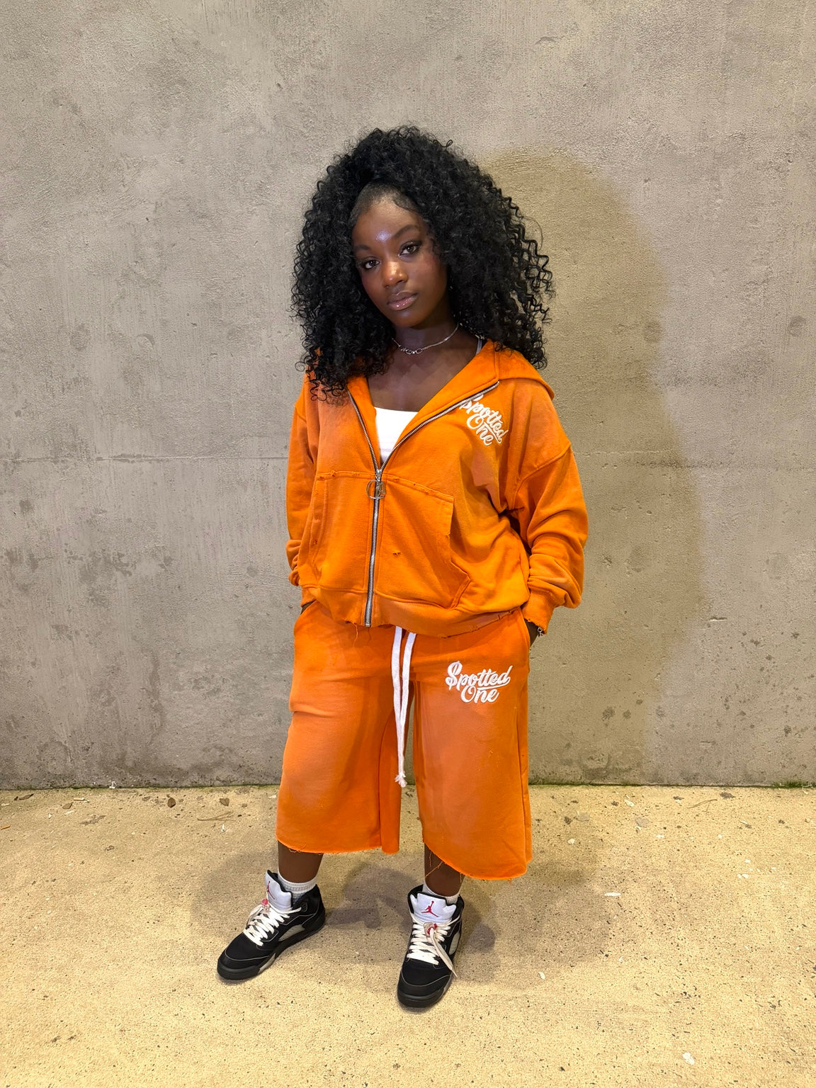 Orange Spotted One long shorts styled on body