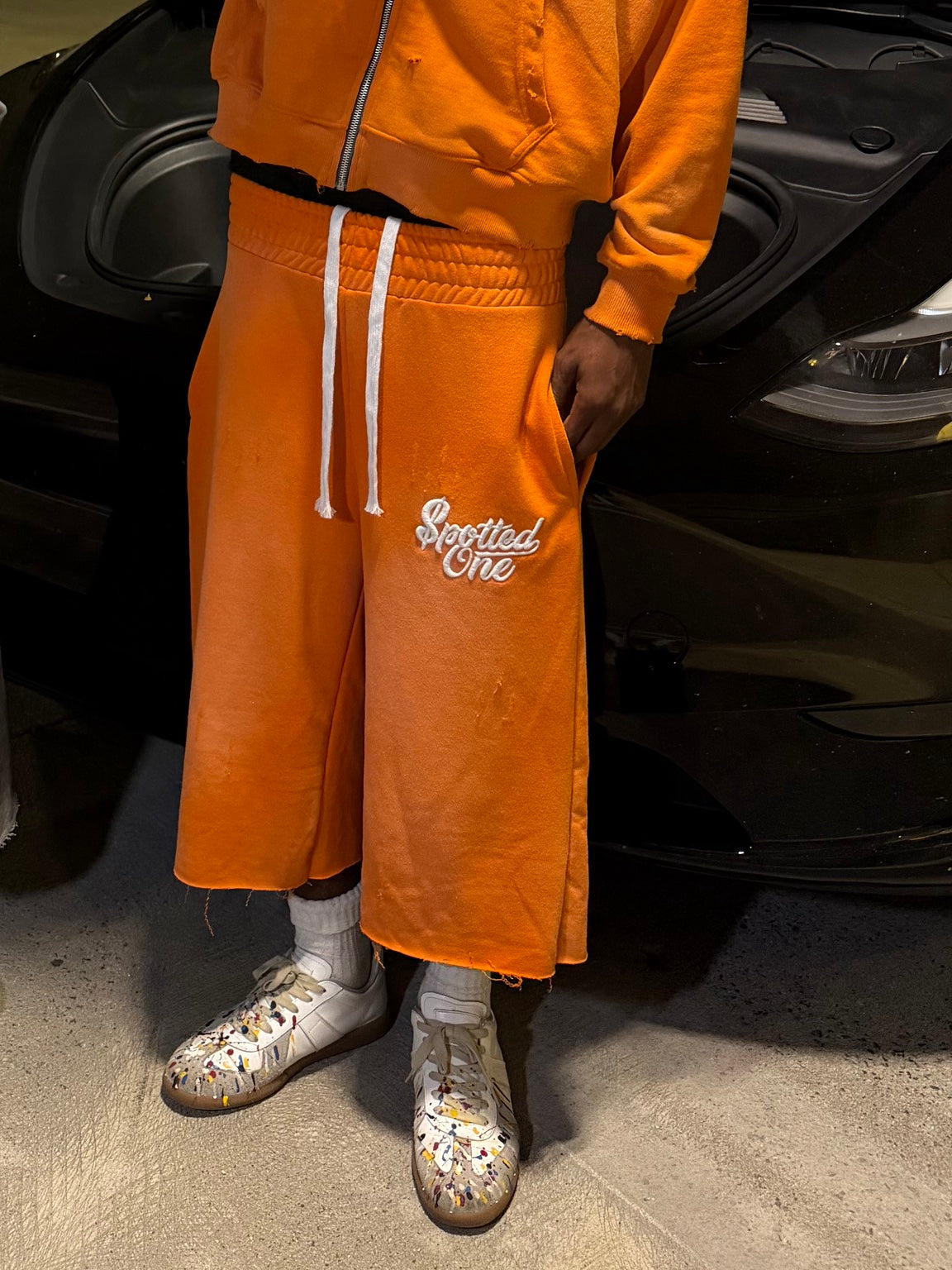 Orange Spotted One long shorts styled on body