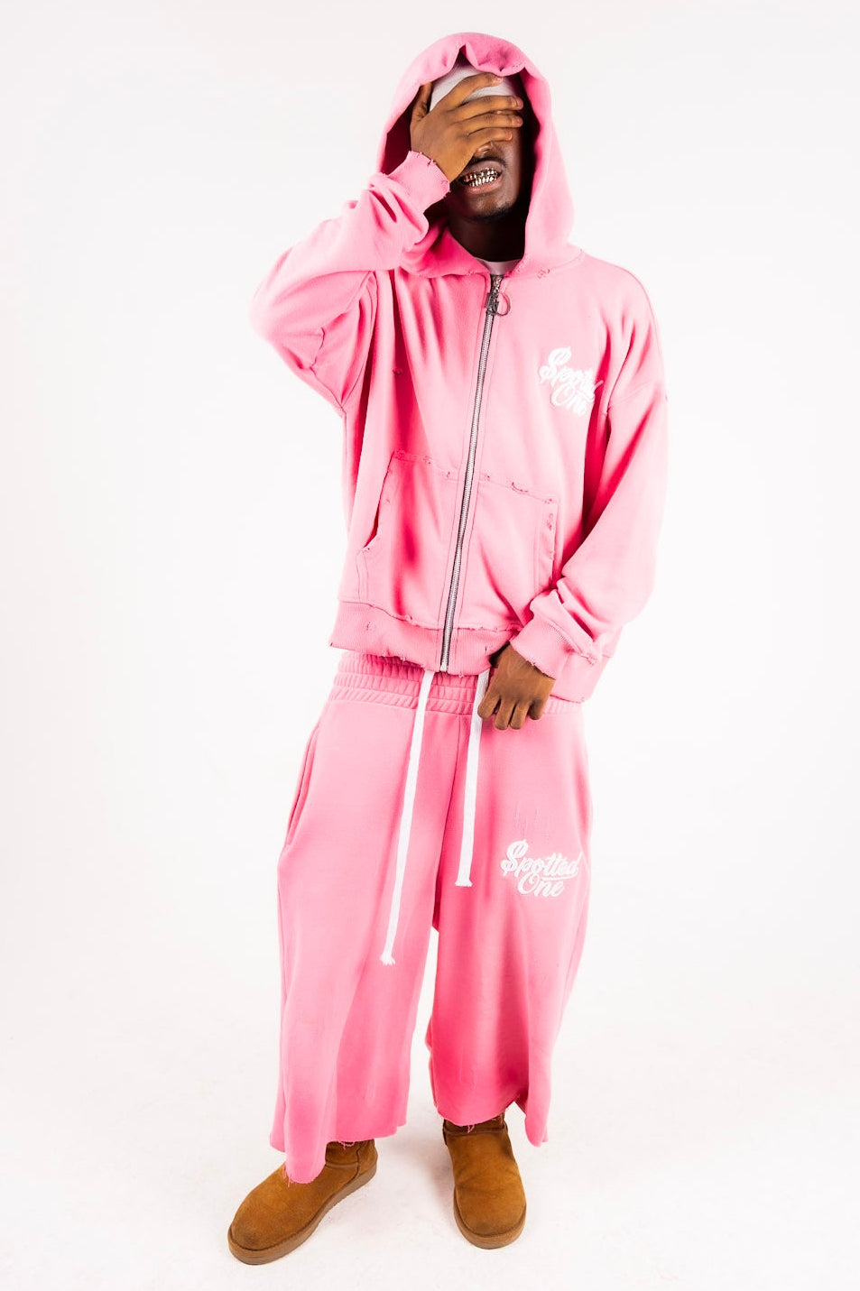 Pink Spotted One long shorts styled on body; zip-up sold separately