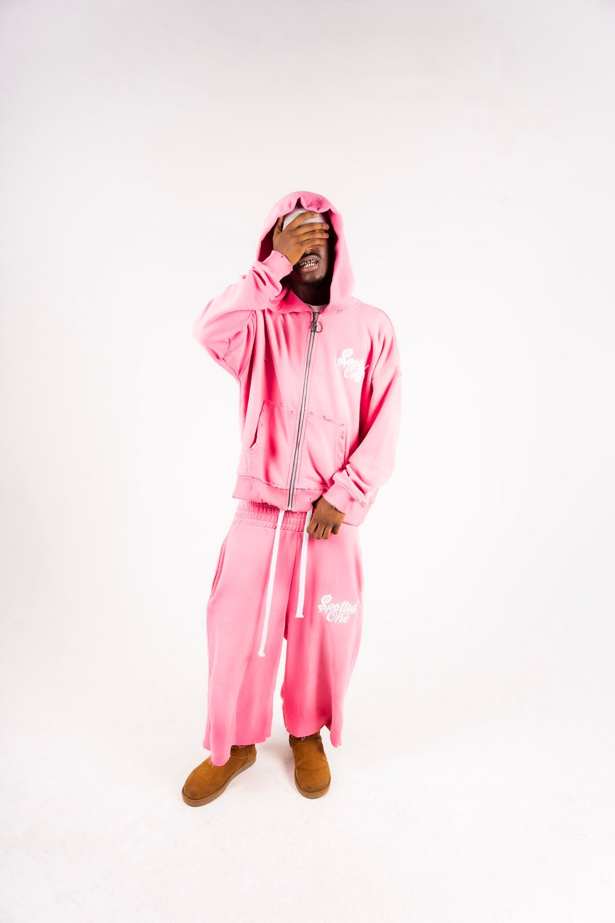 Pink Spotted One Essentials zip-up styled on body; shorts sold separately