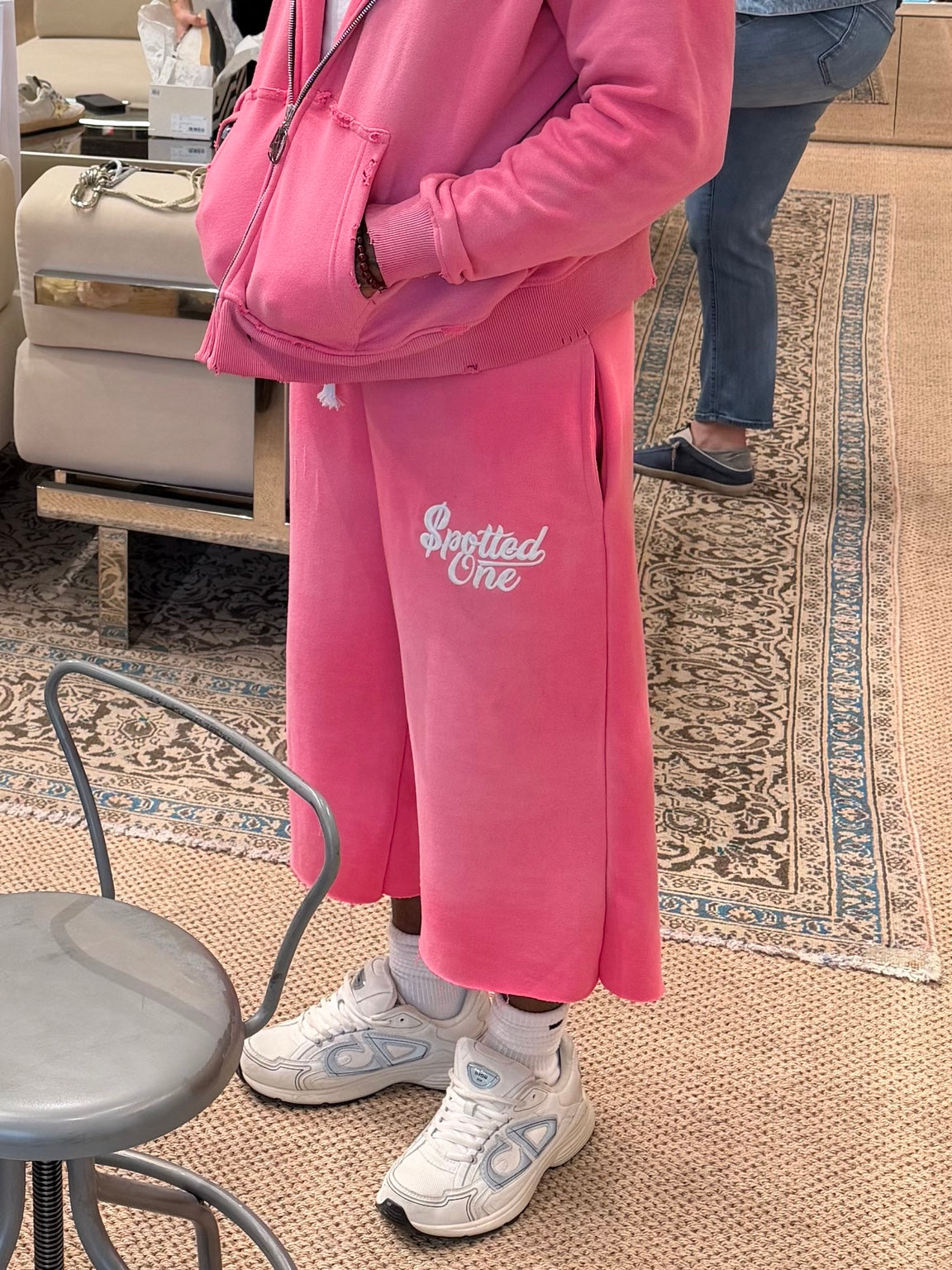 Pink Spotted One long shorts styled on body; zip-up sold separately