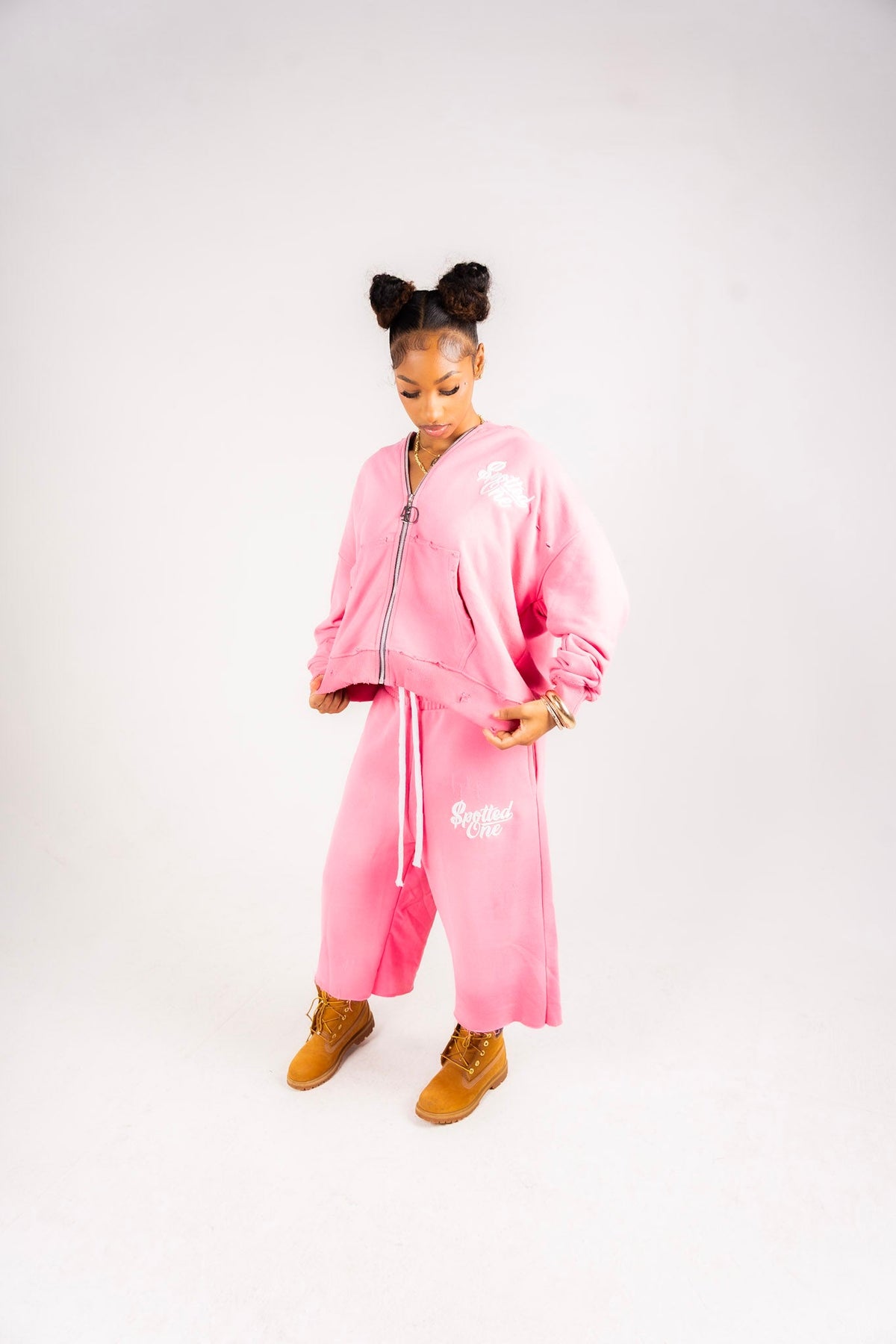 Pink Spotted One Essentials zip-up styled on body; shorts sold separately